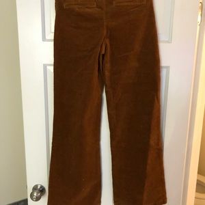 Burnt Orange, bell bottom corduroy pants. Size 2. Zips on side. Not for tall.